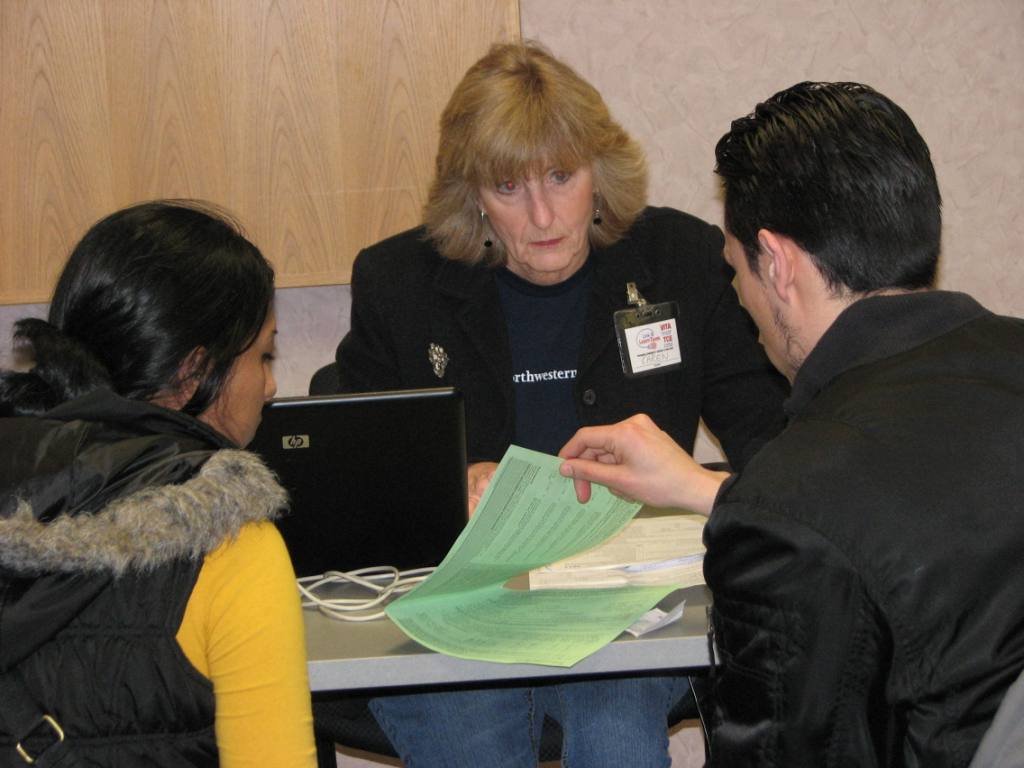 Volunteer from Northwestern Mutual helps residents with their taxes during the most recent VITA tax season.