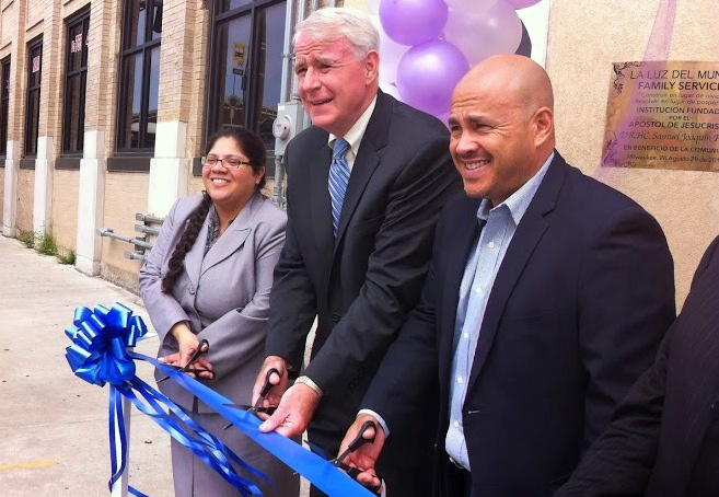 Executive director Patricia Ruiz-Cantu cuts the ribbon with Mayor Tom Barrett and Jose Perez during an event celebrating the opening of La Luz del Mundo Family Services violence prevention center.  (Photo by Brendan O'Brien)