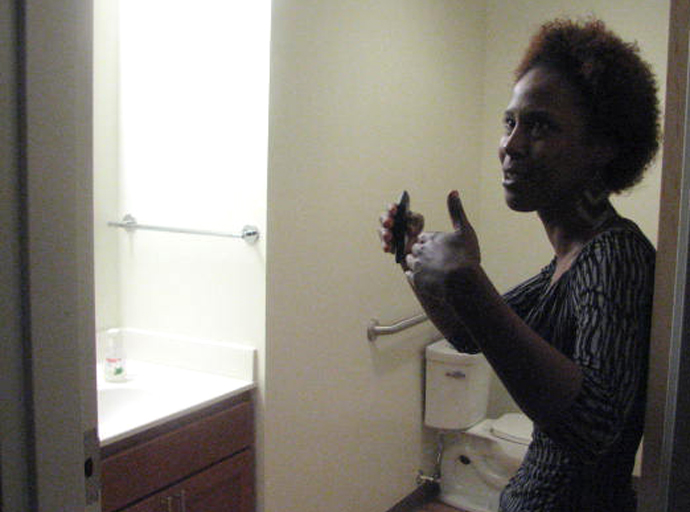 Mercia Harris-Williams shows off her new apartment at Maskani Place. (Photo by Brendan O’Brien)
