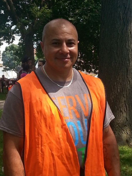 Anthony Mercado, who grew up in Clarke Square, participated in the Clarke Square cleanup. (Photo by Raina J. Johnson) 
