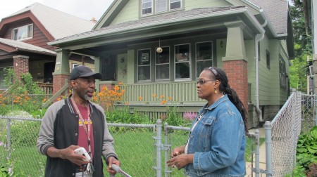 Borchert Field C.A.R.E.S. Secretary Charles Robinson, Sr. and Chair Denise Wooten chat in front of Wooten’s house on 14th Street. (Photo by Andrea Waxman)