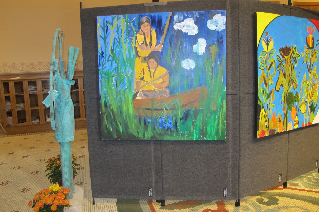 The vibrant paintings on display at City Hall were created by youth at the Urban Ecology Center in Menomonee Valley this summer. (Photo by Raina J. Johnson)