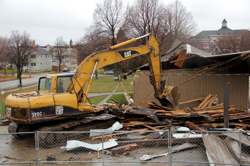 A backhoe driver demolishes the Johnsons Park pavilion to make way for a new restroom building and other improvements next spring and summer. (Photo by Molly Rippinger)