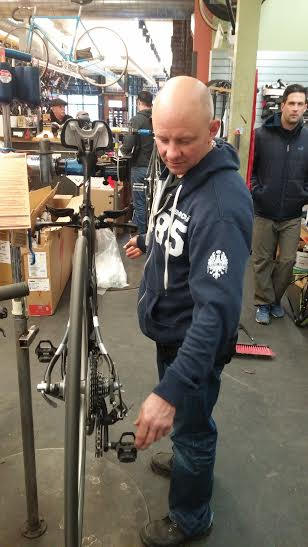 Ben’s Cycle & Fitness owner Vince Hanoski works on a bike at his store on Lincoln Avenue. (Photo by Paul Warloski)