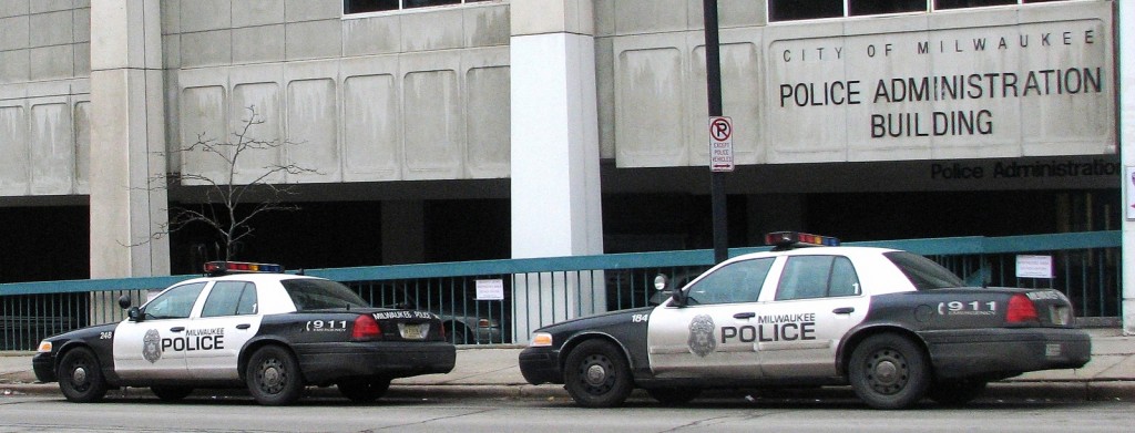 Squad cars are parked outside of the City of Milwaukee Police Administration building. (Photo by Brendan O’Brien)