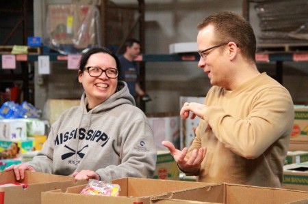Leanne Drives and Kevin Buss, employees of Northwestern Mutual, volunteer at Feeding America Eastern Wisconsin. (Photo by Molly Rippinger)  