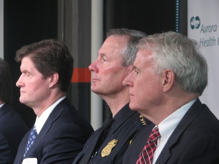 Milwaukee District Attorney John Chisholm (left), Milwaukee Police Department Chief Edward Flynn and Mayor Tom Barrett listen as members of Near West Side Partners explain the PARC initiative. (Photo by Brendan O’Brien) 