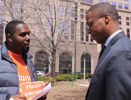 Barney Moore (right) shares his thoughts on racism with YWCA volunteer Donte Moore (no relation). (Photo by Matthew Wisla)