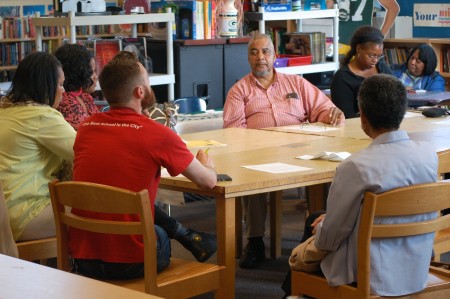 Amani resident Arthur West (center facing camera) participates in a recent planning meeting for Moody Park. (Photo by Edgar Mendez)