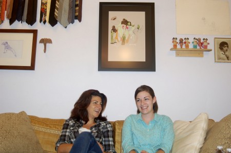 Faith Kohler (left) and producer Jessica Farrell converse in the studio space they share with other local artists in Brewer’s Hill. (Photo by Allison Dikanovic)