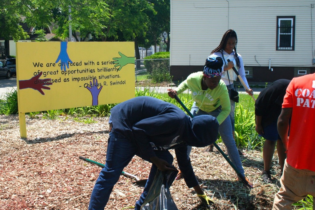 Cleveland Easley and other students work at a pocket park on 19th Street and Meinecke Avenue. (Photo by Jabril Faraj)