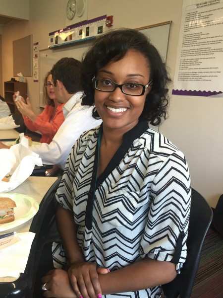 Tianna McCullough, instructional coach for culture at Carver Academy, takes a lunch break after the morning session on adult learning principles. (Photo by Andrea Waxman)