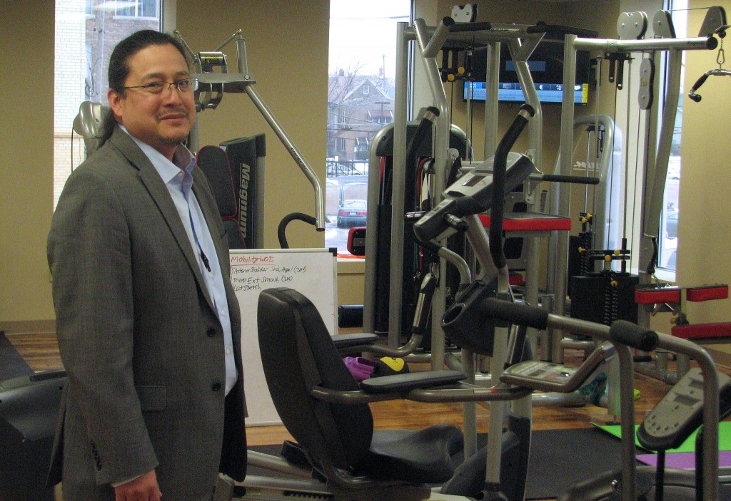 Dr. Lyle Ignace, the executive director of Gerald L. Ignace Indian Health Center, stands in the fitness center in the center’s new building. (Photo by Brendan O’Brien) 