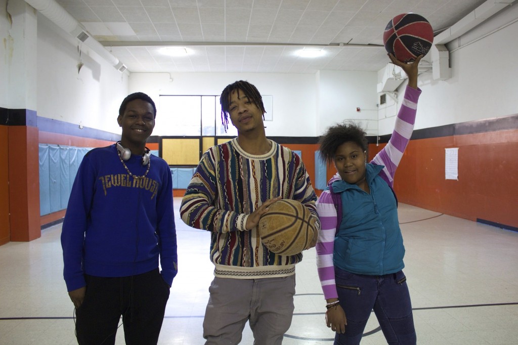 Rodney McCoy, Cameron Henderson and Zuriah Haynes pose during their basketball game. (Photo by Emmy A. Yates) 