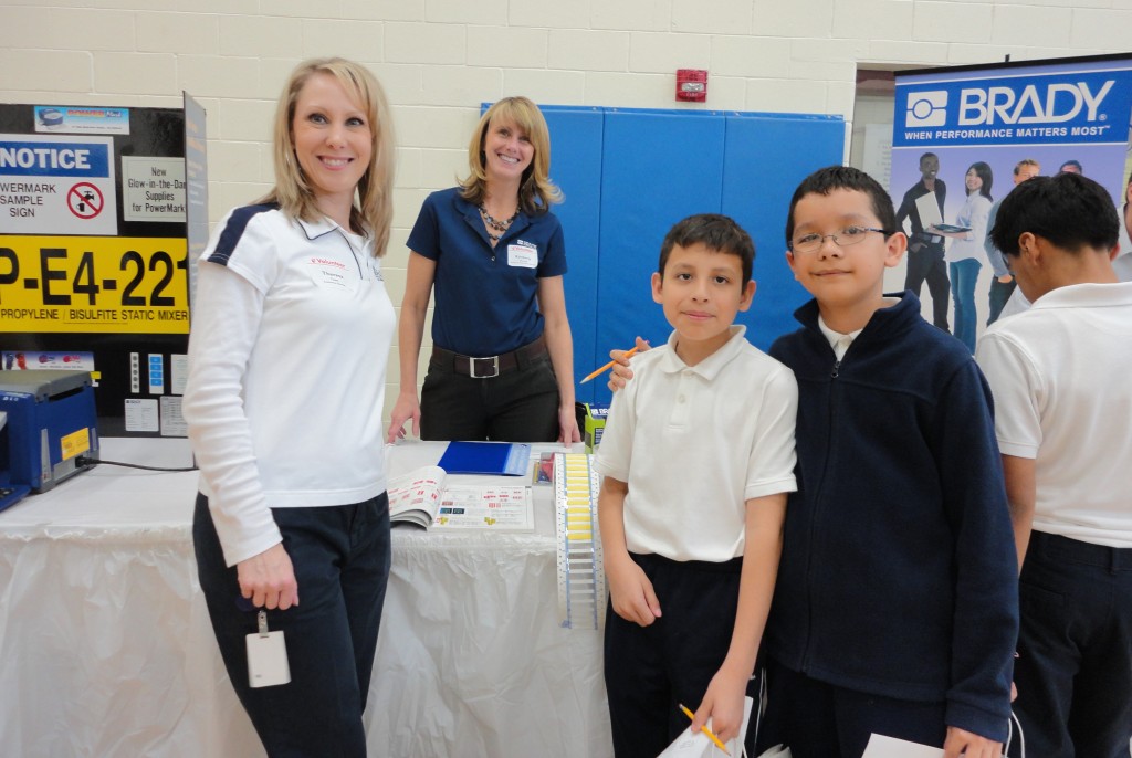 Volunteers help out at United Community Center's Bruce-Guadalupe Middle School Career Day. (Photo courtesy of United Community Center)