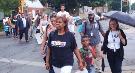 MICAH youth leaders and representatives from some of the organization’s 43 interfaith congregations march from Calvary Baptist Church, 2959 N. Teutonia Ave., to Incarnation Lutheran Church, 1510 W. Keefe Ave. (Photo by Andrea Waxman)