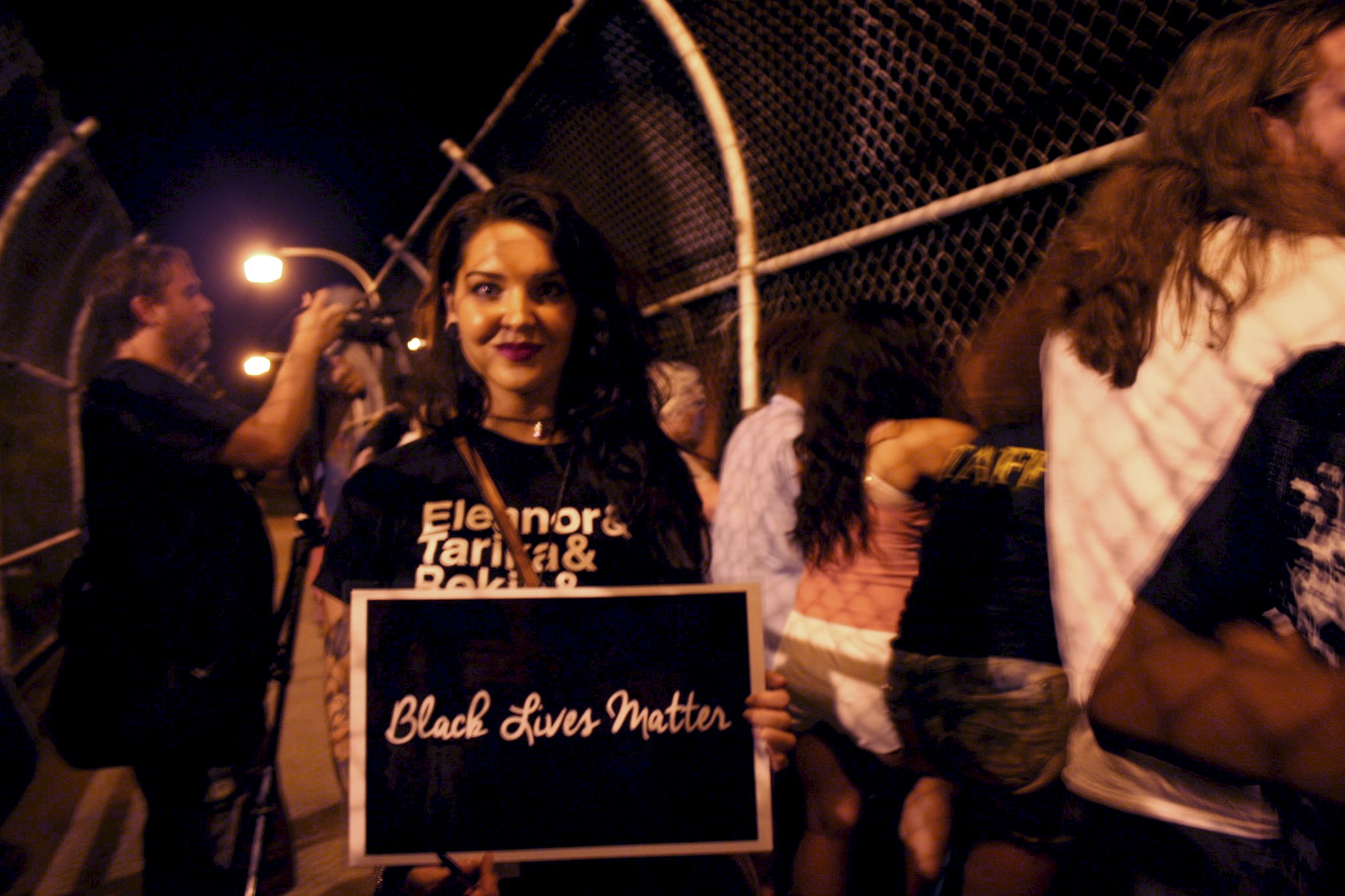 Claire Van Fossen holds a “Black Lives Matter” sign during the demonstration. (Photo by Jabril Faraj)