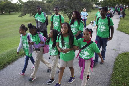 A group of children lead the UNCOM Walk for Wellness to support healthier living, in September 2015. (Photo by Emmy A. Yates)