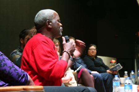 Andre Lee Ellis speaks from the stage during a panel discussion at a recent UEDA summit. (Photo by Jabril Faraj)