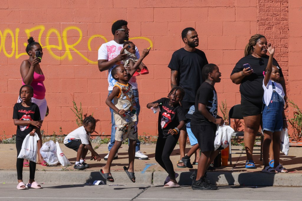 Attendees watch as the 55th Juneteenth Jubilee Parade passes by on Friday, June 19, 2026 in Milwaukee. (Photo by Jonathan Aguilar / Milwaukee Neighborhood News Service / CatchLight Local)