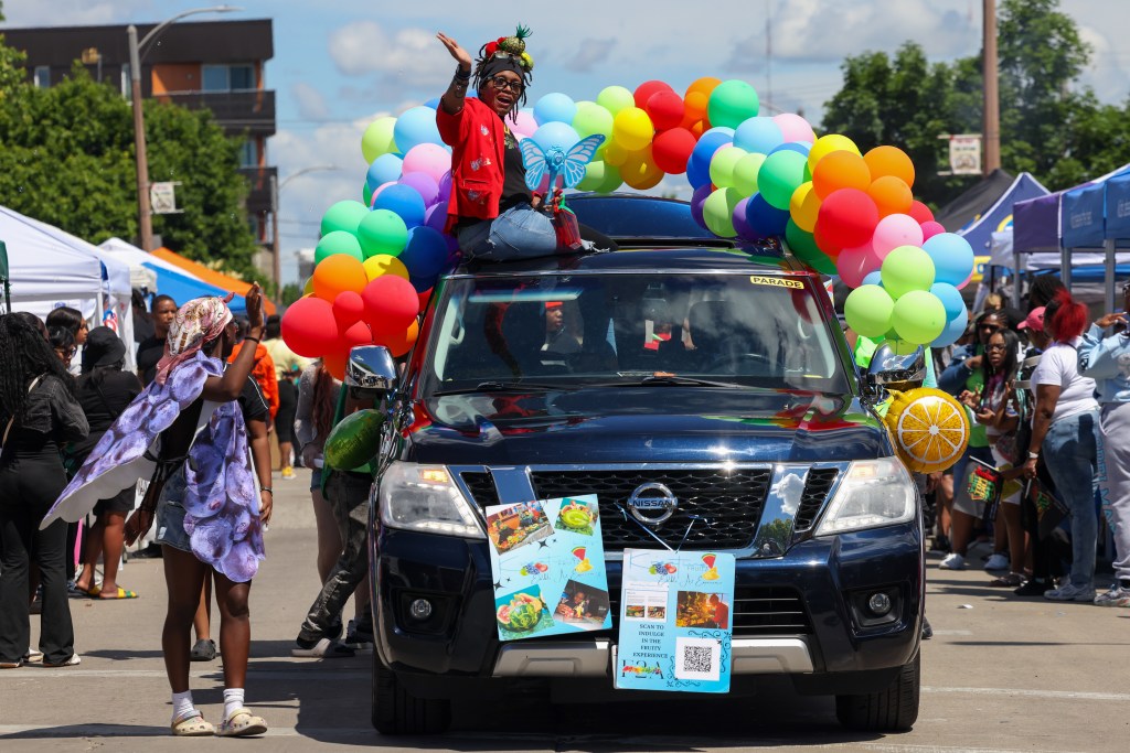 Imani Raiyne, founder of Kreative Fruitz, waves to the crowd during the 55th Juneteenth Jubilee Parade on Friday, June 19, 2026 in Milwaukee. (Photo by Jonathan Aguilar / Milwaukee Neighborhood News Service / CatchLight Local)