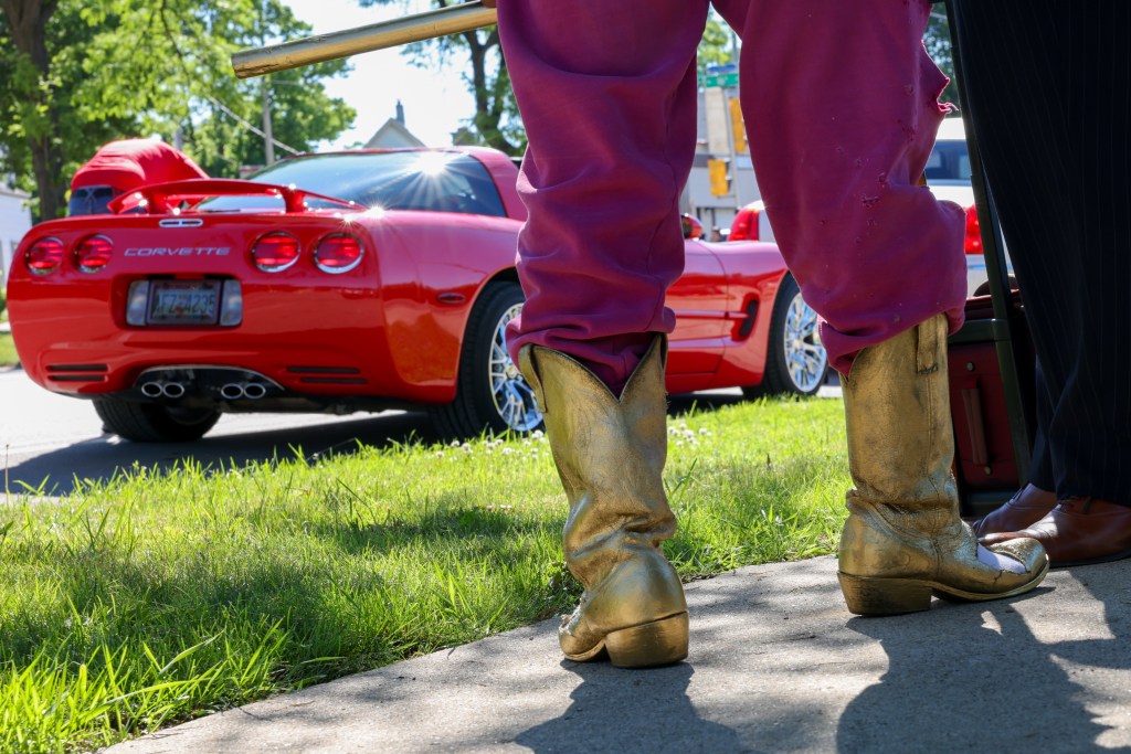 An attendee wears gold painted boots during the 55th Juneteenth Jubilee Parade on Friday, June 19, 2026 in Milwaukee. (Photo by Jonathan Aguilar / Milwaukee Neighborhood News Service / CatchLight Local)