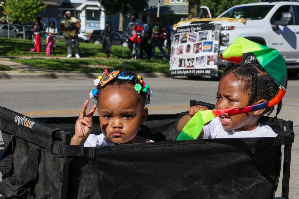 Children ride in a wagon during the 55th Juneteenth Jubilee Parade on Friday, June 19, 2026 in Milwaukee. (Photo by Jonathan Aguilar / Milwaukee Neighborhood News Service / CatchLight Local)