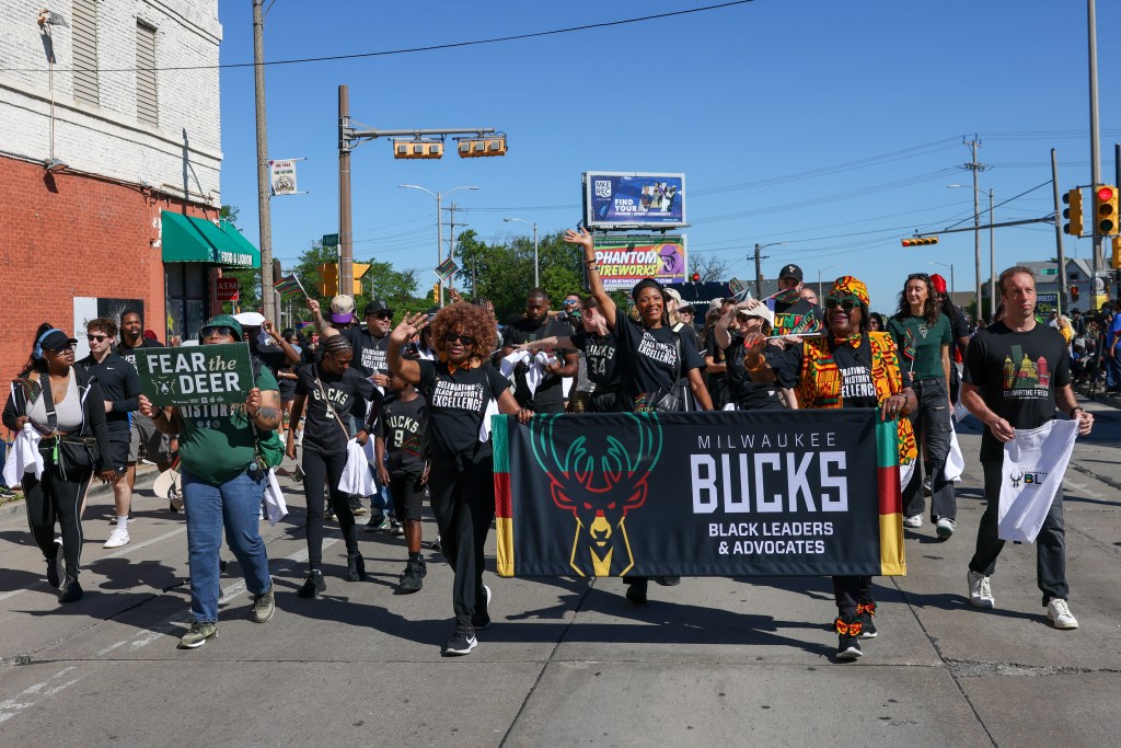 People with the Milwaukee Bucks walk during the 55th Juneteenth Jubilee Parade on Friday, June 19, 2026 in Milwaukee. (Photo by Jonathan Aguilar / Milwaukee Neighborhood News Service / CatchLight Local)