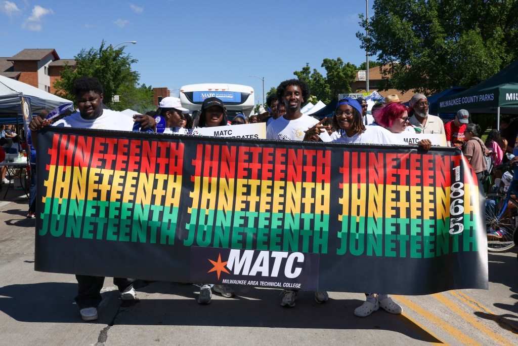 People with MATC walk through the 55th Juneteenth Jubilee Parade on Friday, June 19, 2026 in Milwaukee. (Photo by Jonathan Aguilar / Milwaukee Neighborhood News Service / CatchLight Local)